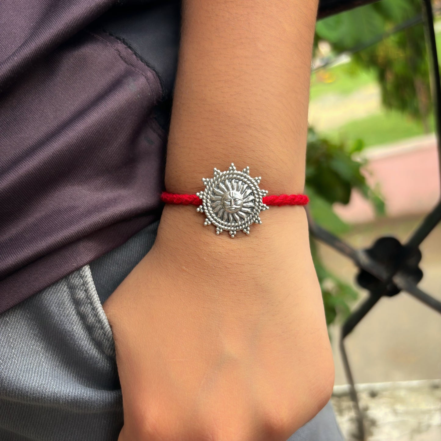 Silver Suraj rakhi cum brooch