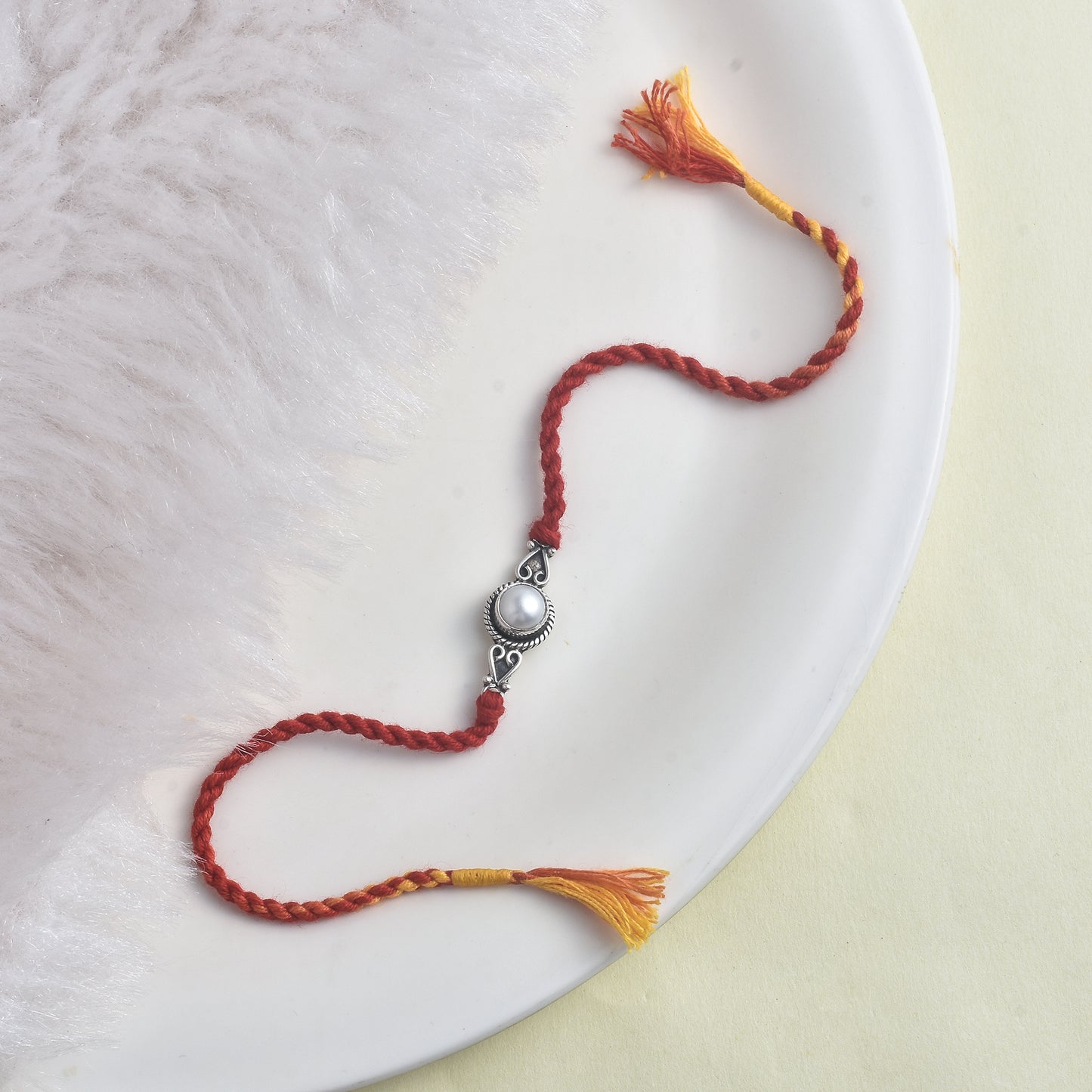 Silver Spiral Pearl rakhi