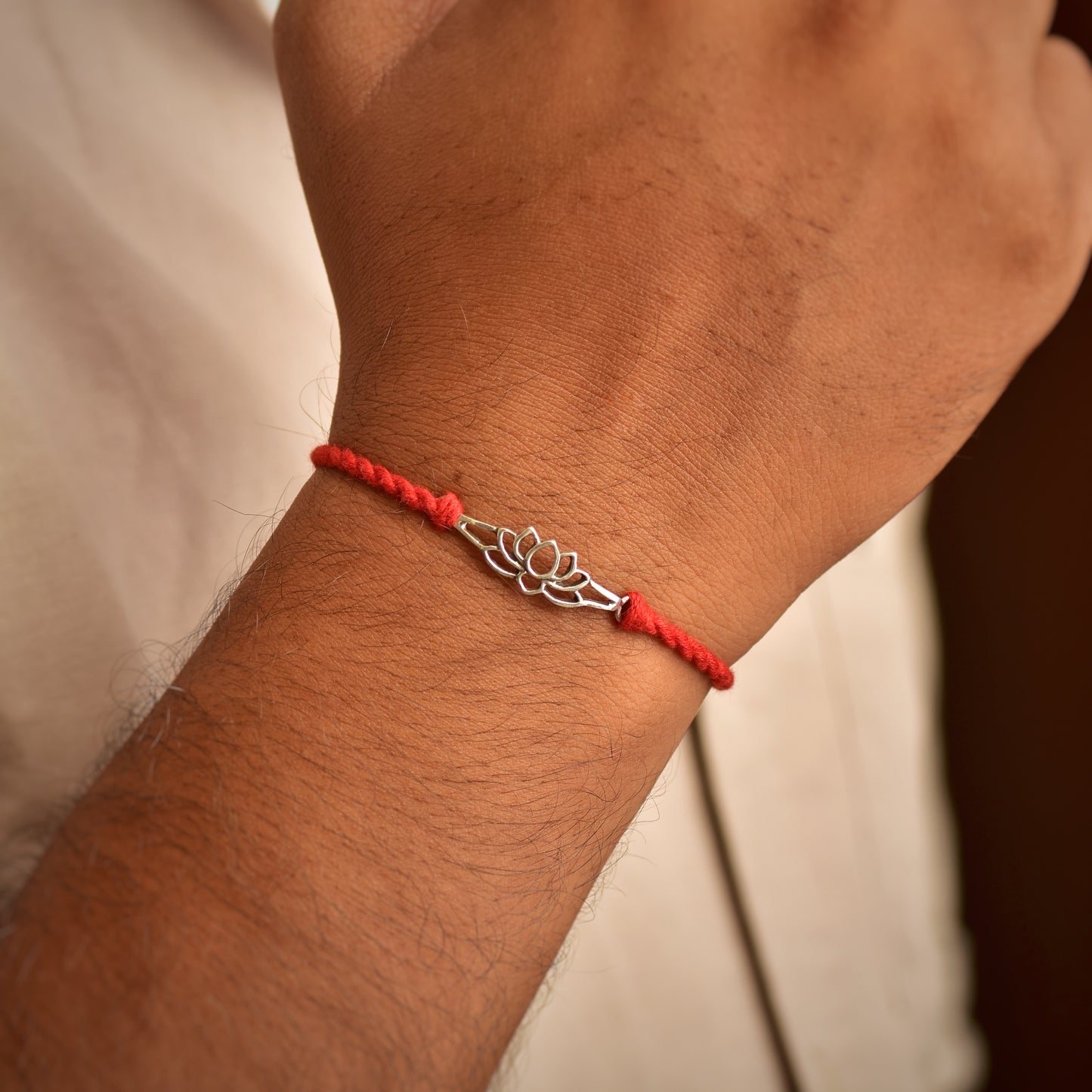 Silver Lotus Charm Prosperity Rakhi