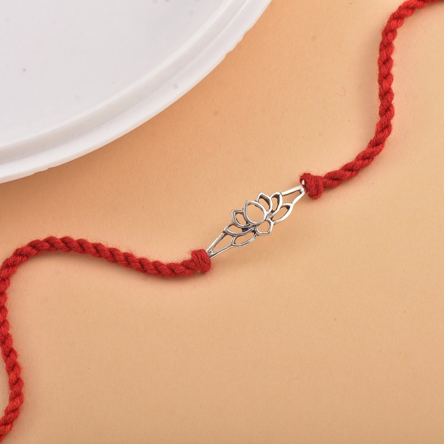 Silver Lotus Charm Prosperity Rakhi