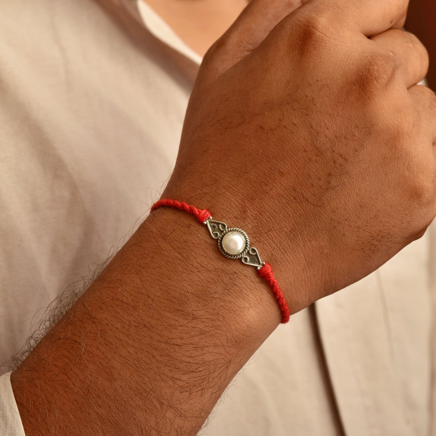 Silver Spiral Pearl rakhi