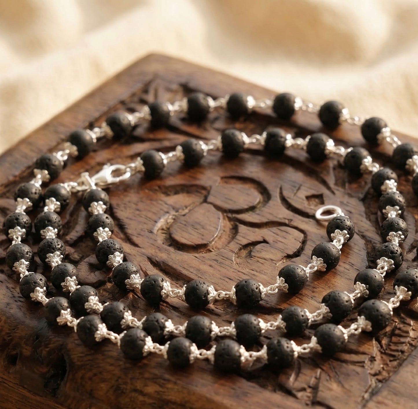 Karungali Mala made in pure 925 sterling silver On a engraved wooden box surface