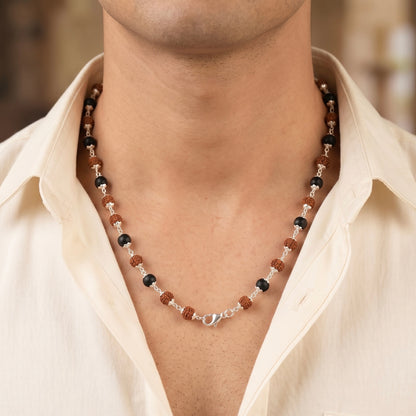 Close up of model neck wearing a karungali and rudraksha mala made in pure 925 sterling silver by silveristhan