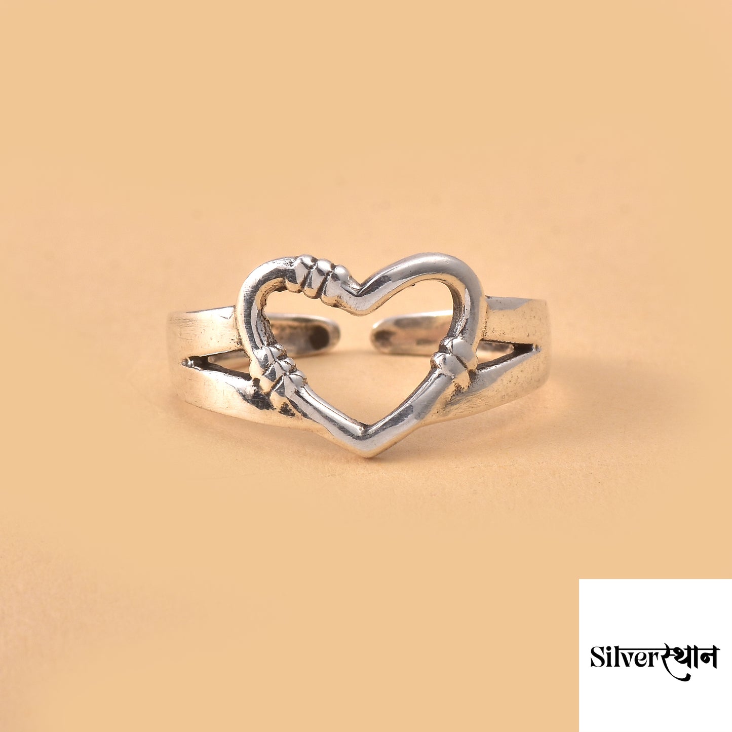 Sterling Silver Heart Shape Ring By Silveristhan on a beige color background