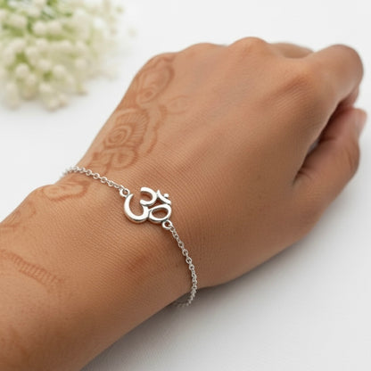 925 Silver bracelet with Om symbol on a wrist against a white background