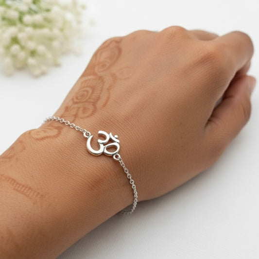 925 Silver bracelet with Om symbol on a wrist against a white background